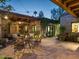 Charming patio area featuring brick flooring, comfortable seating, and lush greenery for outdoor relaxation at 8022 N Ironwood Dr, Paradise Valley, AZ 85253