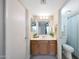 Well-maintained bathroom with wood vanity, framed mirror, and a combined shower and bathtub at 850 S River Dr # 1047, Tempe, AZ 85281