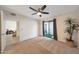 Bedroom featuring ceiling fan, neutral carpet, and sliding glass doors to the outdoor patio at 850 S River Dr # 1047, Tempe, AZ 85281
