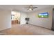 Spacious bedroom with a ceiling fan, adjoining bathroom, and a serene atmosphere at 850 S River Dr # 1047, Tempe, AZ 85281