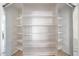 A photo of a very large empty walk-in closet with multiple shelves and mirrors on the doors at 850 S River Dr # 1047, Tempe, AZ 85281