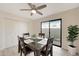 Cozy dining space with a ceiling fan, storage closet, and sliding doors to the patio at 850 S River Dr # 1047, Tempe, AZ 85281