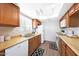 Well-lit kitchen with bright cabinets, matching appliances, and stylish accents at 850 S River Dr # 1047, Tempe, AZ 85281
