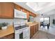 Charming kitchen featuring wood cabinets, modern appliances, and a light-filled breakfast nook at 850 S River Dr # 1047, Tempe, AZ 85281