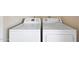 A side-by-side view of a washing machine and clothes dryer in a laundry room at 850 S River Dr # 1047, Tempe, AZ 85281