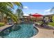 Lush backyard oasis with a refreshing pool, pergola, seating, mature trees, and inviting water features at 10033 W Jessie Ln, Peoria, AZ 85383