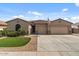 Charming single-story home with a well-manicured lawn and a spacious two-car garage, perfect for comfortable living at 10033 W Jessie Ln, Peoria, AZ 85383