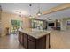 Open kitchen layout with large island and stainless steel appliances at 10033 W Jessie Ln, Peoria, AZ 85383