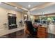 Spacious home office seamlessly transitions to the living room with a view of the backyard, perfect for relaxation at 10033 W Jessie Ln, Peoria, AZ 85383