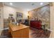 Bright, wood-floored home office with built-in features and natural light, creating an ideal workspace at 10033 W Jessie Ln, Peoria, AZ 85383