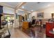 A home office with wood floors, built-in shelving, and a view of the backyard, promoting productivity at 10033 W Jessie Ln, Peoria, AZ 85383
