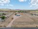 Vast acreage showcasing a single-story house with plenty of space and desert vegetation at 11192 N Johnson Rd, Maricopa, AZ 85139