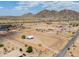 Large parcel of land with mountain views, single story home, and desert landscape at 11192 N Johnson Rd, Maricopa, AZ 85139