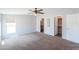 Large bedroom with soft carpet, bright window, and walk-in closet at 11192 N Johnson Rd, Maricopa, AZ 85139