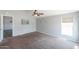 Spacious bedroom with a ceiling fan, plush carpet, and lots of natural light at 11192 N Johnson Rd, Maricopa, AZ 85139