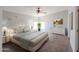 Spacious bedroom with soft carpet, white dresser, and a calming color palette at 11192 N Johnson Rd, Maricopa, AZ 85139