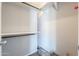 View of a closet with a clothes rack and shelving, offering storage space and organization at 11192 N Johnson Rd, Maricopa, AZ 85139