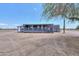 Single story home with a screened in porch and desert landscape at 11192 N Johnson Rd, Maricopa, AZ 85139