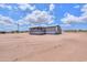Charming single story home with a screened in porch and desert landscape at 11192 N Johnson Rd, Maricopa, AZ 85139