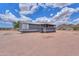 Single story home with a screened in porch and desert landscape at 11192 N Johnson Rd, Maricopa, AZ 85139