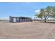Single story home with a screened in porch and desert landscape at 11192 N Johnson Rd, Maricopa, AZ 85139