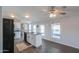 Modern kitchen with a center island, updated appliances, and open layout with natural lighting at 11192 N Johnson Rd, Maricopa, AZ 85139