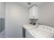 Clean laundry area with updated washer and dryer set against a neutral wall at 11192 N Johnson Rd, Maricopa, AZ 85139