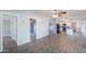 Expansive living room with hardwood floors, soft grey walls, and generous natural light at 11192 N Johnson Rd, Maricopa, AZ 85139