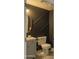 Chic half-bath with textured walls, unique fixtures, and compact design at 11333 N 92Nd St # 1075, Scottsdale, AZ 85260