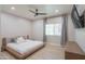 Modern bedroom with natural light, platform bed, and stylish gray accent wall at 11333 N 92Nd St # 1075, Scottsdale, AZ 85260