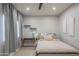 Comfortable bedroom with a cozy bed, desk area, and modern window treatments at 11333 N 92Nd St # 1075, Scottsdale, AZ 85260