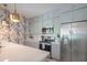 Modern kitchen boasts stainless steel appliances, grey cabinetry, and ample counter space at 11333 N 92Nd St # 1075, Scottsdale, AZ 85260
