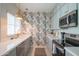 Stylish kitchen featuring updated appliances, white countertops, and modern backsplash at 11333 N 92Nd St # 1075, Scottsdale, AZ 85260