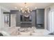 Living room with modern fireplace, mounted TV, and views into the dining area at 11333 N 92Nd St # 1075, Scottsdale, AZ 85260