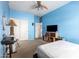 Well-lit bedroom with a ceiling fan, closet, and plenty of sunlight at 1145 E Harold Dr, San Tan Valley, AZ 85140