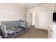 Bedroom with cozy carpet, closet and an open entrance to the bedroom at 1145 E Harold Dr, San Tan Valley, AZ 85140