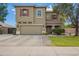 Two-story home featuring a spacious two-car garage, red shutters, and well-maintained landscaping at 1145 E Harold Dr, San Tan Valley, AZ 85140