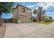 View of the home featuring a spacious two-car garage and landscaped yard at 1145 E Harold Dr, San Tan Valley, AZ 85140