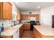 Kitchen featuring wood cabinets, and stainless steel appliances at 1145 E Harold Dr, San Tan Valley, AZ 85140