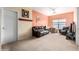 Cozy living room with a ceiling fan, a couch, and plenty of sunlight at 1145 E Harold Dr, San Tan Valley, AZ 85140
