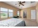 Main bedroom boasting large windows, carpet and tiled floors at 1145 E Harold Dr, San Tan Valley, AZ 85140