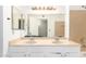 Double vanity with bright lighting, providing elegance and convenience at 11524 W Rosewood Dr, Avondale, AZ 85392