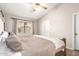 Bedroom with wood-look floors and large bed at 11524 W Rosewood Dr, Avondale, AZ 85392