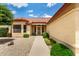 Inviting home entrance with pathway and manicured landscaping, creating a welcoming approach at 11524 W Rosewood Dr, Avondale, AZ 85392