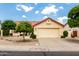 Charming home featuring a two-car garage and a well-maintained front yard with desert landscaping at 11524 W Rosewood Dr, Avondale, AZ 85392
