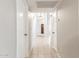 Hallway featuring tile floors and white walls at 11524 W Rosewood Dr, Avondale, AZ 85392