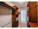 Walk-in closet with custom shelving and storage space at 12448 N 76Th St, Scottsdale, AZ 85260