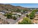 Overhead shot of residential area featuring diverse houses, desert foliage, and tree-lined streets at 12835 N 16Th Dr, Phoenix, AZ 85029