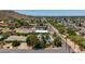 Expansive aerial view of a neighborhood with desert landscaping, homes, and nearby mountains at 12835 N 16Th Dr, Phoenix, AZ 85029