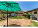 Backyard featuring green lawn, patio, and shed at 12835 N 16Th Dr, Phoenix, AZ 85029